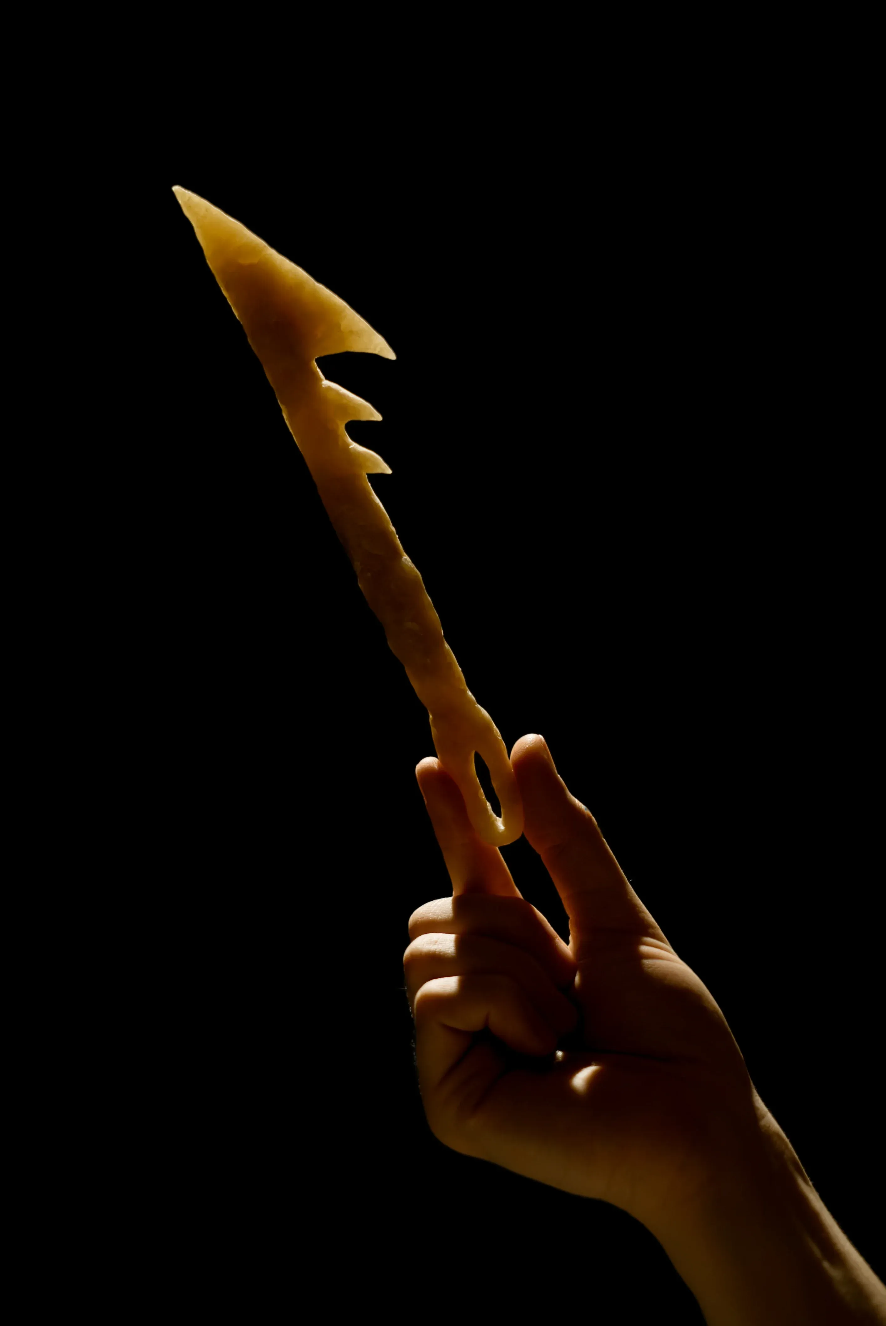 A wax sculpture resembling a harpoon.